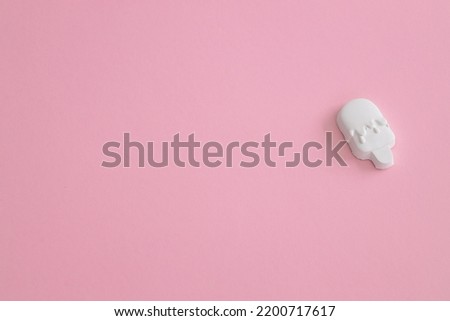 Plaster figure of ice cream on a colored background