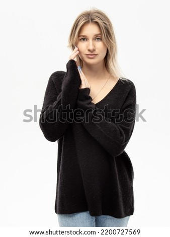 Black cashmere sweater. Woman in warm blouse for autumn or winter on white background