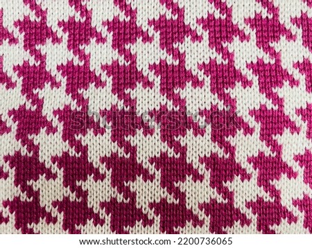 chicken foot pattern on bright pink jersey Royalty-Free Stock Photo #2200736065