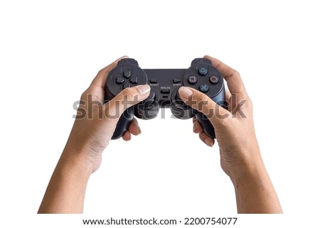 Close up of female hands playing the video game isolated on white background