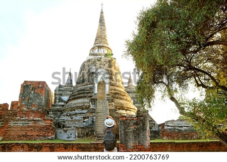 Visitor Taking Photos of the Historic Pagoda in Wat Phra Si Sanphet Temple, Ayutthaya Historical Park, Thailand