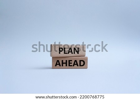 Plan ahead symbol. Wooden blocks with words Plan ahead. Beautiful white background. Businessman hand. Business and Plan ahead concept. Copy space.