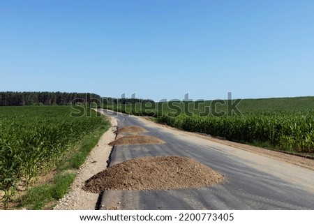 Construction and repair of a new highway in rural areas, a narrow paved road during its construction