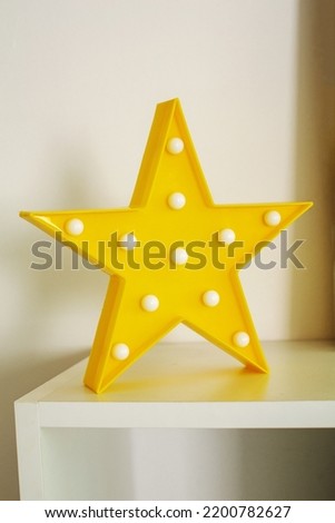 Table lamp in the form of stars. The night lamp glows in the dark.