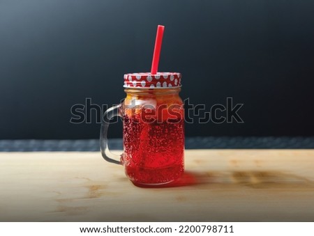 Redberries Lemonade in closed glass bottle with Suction, isolated background