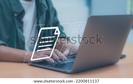 worker typing on laptop keyboard to document management system (DMS) or databases, concept of using technology to manage files document storage in digital format of organization business effectively. Royalty-Free Stock Photo #2200811137