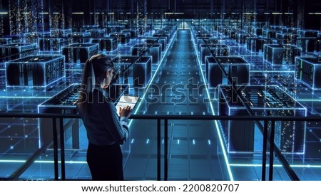 Successful Female Data Center IT Specialist Using Tablet Computer, Turning Augmented VFX Visualization on Server Farm Cloud Computing Facility. System Engineer Working for Cyber Data Security Company.