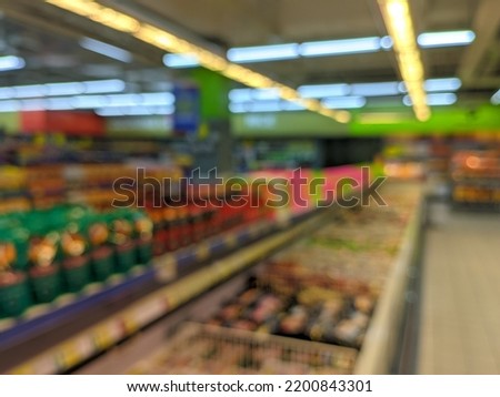 Defocused photo background of urban supermarket with bokeh light effect. 