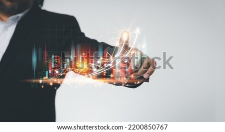 Businessman touching virtual screen growth graph with copy space. Planning strategy, and analyzing marketing for a higher profit for a business. Investment, and financial concepts.