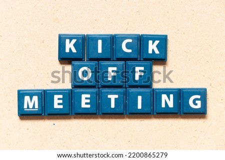 Tile letter in english word kick off meeting on wood background Royalty-Free Stock Photo #2200865279