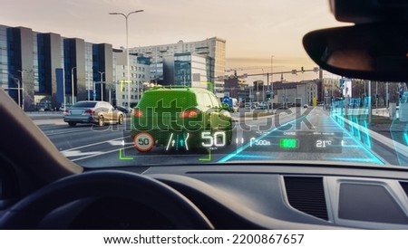 Futuristic Autonomous Self-Driving Car Moving Through City, Head-up Display HUD Showing Infographics: Speed, Distance, Navigation. Road Scanning Concept. View From Driver Seat, First Person View FPV.