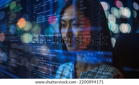 Portrait of Asian Female Startup Digital Entrepreneur Working on Computer, Line of Code Projected on Her Face and Reflecting. Software Developer Working on Innovative e-Commerce AI App, Big Data. Royalty-Free Stock Photo #2200894171
