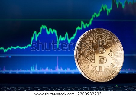 Bitcoin and cryptocurrency investing concept. Bitcoin cryptocurrency coins. Trading on the cryptocurrency exchange. Trends in bitcoin exchange rates. Rise chart of bitcoin and alt coins. Royalty-Free Stock Photo #2200932293