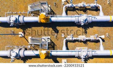 Natural gas pipeline. One part of Nord Stream pipeline from Russia to European Union. High pressure pipes on a hot summer day. Royalty-Free Stock Photo #2200933521