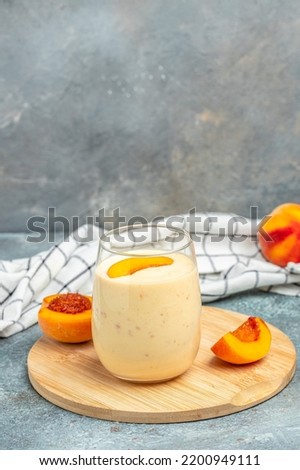 yogurt peaches breakfast drink, fresh blended peach smoothie, vertical image place for text,