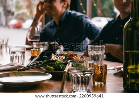 Diner in a fancy French restaurant Royalty-Free Stock Photo #2200959641