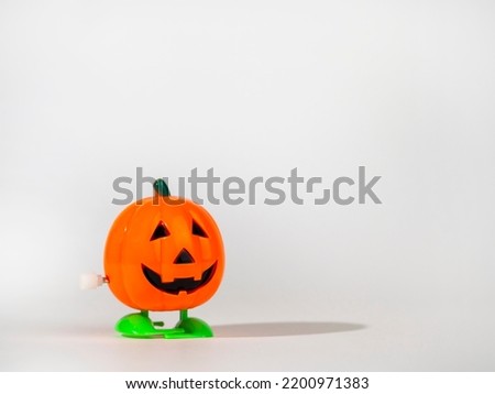 Funny pumpkin figure on a light background.