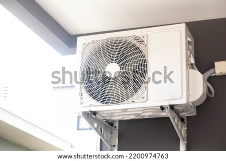 Condensing unit of air conditioning system mounted on outdoor wall, air condensing unit, heat pump or air compressor condensing unit.