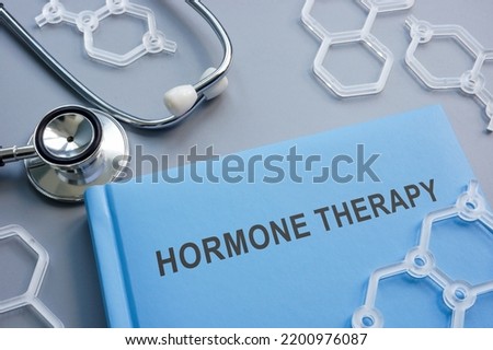 Book hormone therapy and plastic chemical models. Royalty-Free Stock Photo #2200976087
