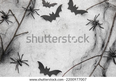 Halloween holiday background with  decorations.  Halloween background with spider web and spiders as symbols of Halloween. View from above. Flat lay