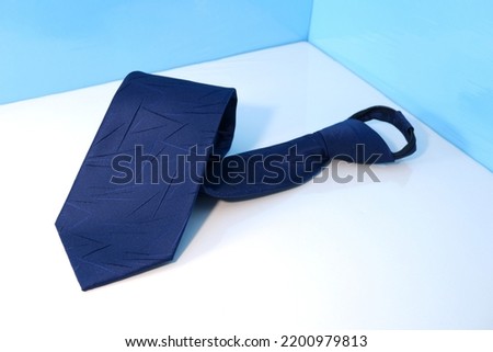 streak texture zipper necktie isolated close up view, a polyester fabric neck tie folded with white backdrop