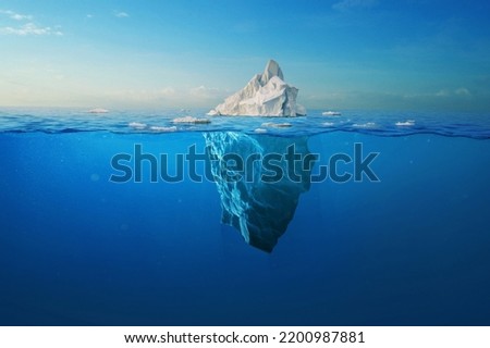 Amazing white iceberg floats in the ocean with a view underwater. Hidden Danger and Global Warming Concept. Tip of the iceberg. Half underwater. Greenland Royalty-Free Stock Photo #2200987881
