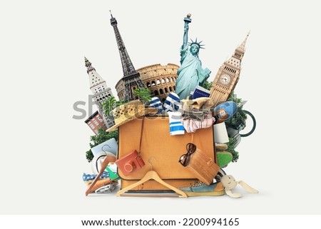 Vacation concept, suitcase with hat and tourist accessories and landmarks. Tourist packing	 Royalty-Free Stock Photo #2200994165
