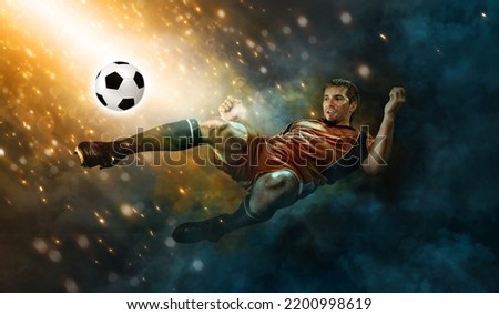 Football player. Soccer player. Man in football sportswear at the game in action with ball. Sport concept.