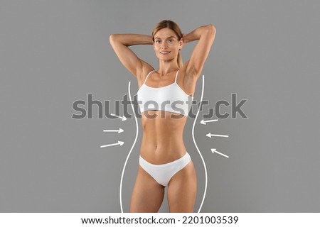 Weightloss Concept. Slim Female In White Underwear With Drawn Outlines And Arrows Around Her Body Posing Isolated Over Grey Background, Sporty Young Woman Smiling At Camera, Copy Space, Collage