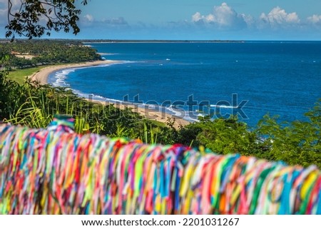 Beach and Lord of Bonfim ribbon tapes symbol of good luck in Trancoso, BAHIA Royalty-Free Stock Photo #2201031267