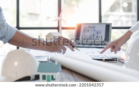 Construction and structure concept of engineer working on blueprint meeting for project working with partner in working site, construction concept  Royalty-Free Stock Photo #2201042357
