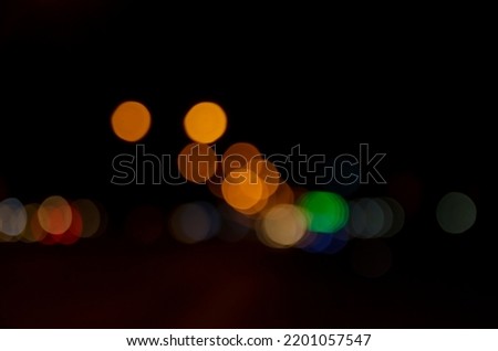 bokeh background of the lamps and cars  light in the night out of focus