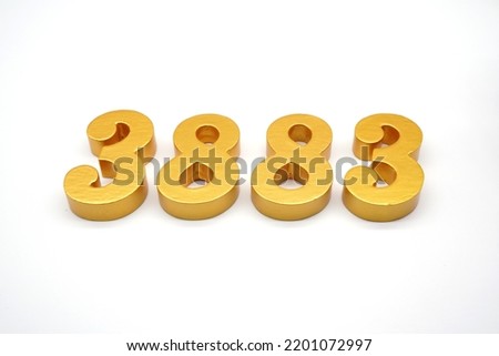     Number 3883 is made of gold-painted teak, 1 centimeter thick, placed on a white background to visualize it in 3D.                             