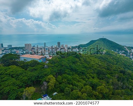 Top view of white Lighthouse in Vung Tau. The most visited tourist location in the Vung Tau city and famous Lighthouse captured with blue sky and cloud.