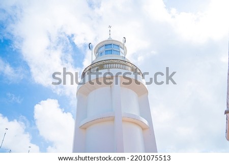 Focus white Lighthouse in Vung Tau. The most visited tourist location in the Vung Tau city and famous Lighthouse captured with blue sky and cloud.