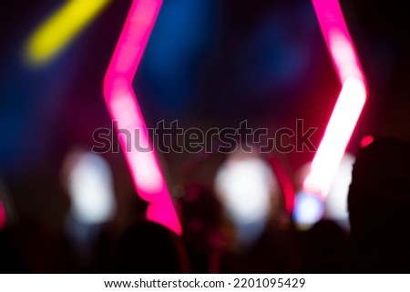 Bright pink stripes of optical bokeh on a dark background.