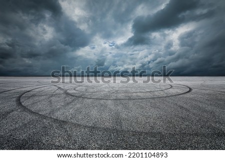 Asphalt road and sky dark clouds nature background