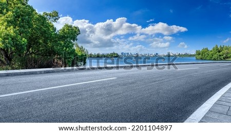 Empty asphalt road and city skyline with modern buildings scenery in Hangzhou, China. Royalty-Free Stock Photo #2201104897