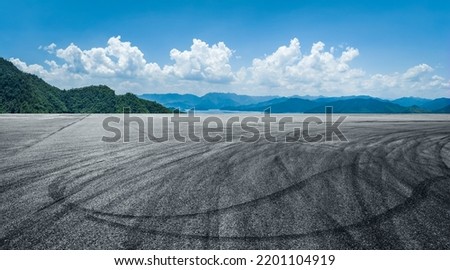 Empty asphalt road and green mountain natural background