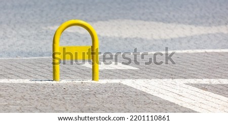 Yellow metal parking limiter. Vehicle parking