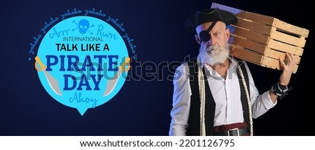 Mature pirate with wooden box on dark background. Talk Like a Pirate Day