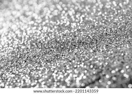 Texture of silver glitter as background, closeup