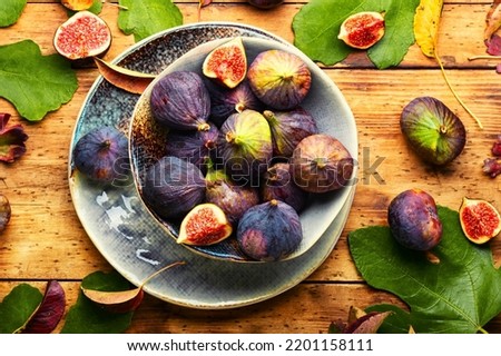 Fresh fig fruits.Ripe tasty figs on the plate Royalty-Free Stock Photo #2201158111