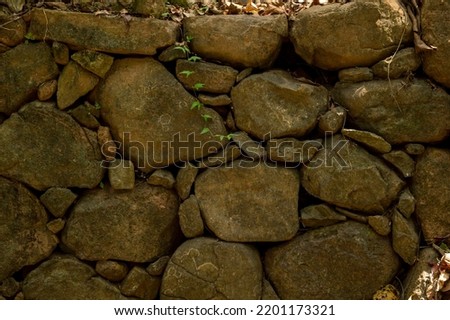 A texture background refers to the perceived feel, appearance or consistency of the surface. Pattern relates to the repetition of a graphic motif on a material. Here are some stones and rocks.