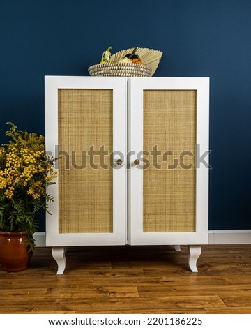 White painted furniture with rattan boho style Royalty-Free Stock Photo #2201186225