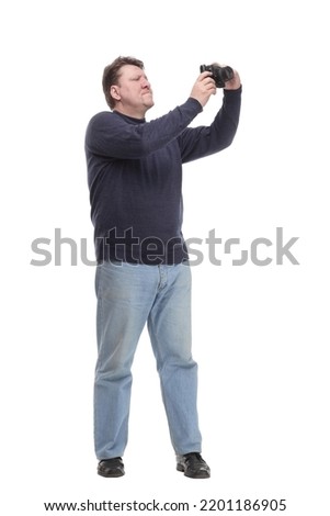 mature man with a camera.isolated on a white background.