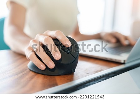 woman hand using computer ergonomic mouse, prevention wrist pain because working long time. De Quervain s tenosynovitis, Intersection Symptom, Carpal Tunnel Syndrome or Office syndrome concept Royalty-Free Stock Photo #2201221543