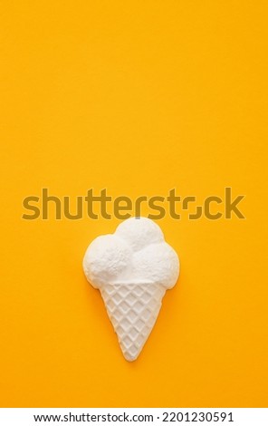 Plaster figure of ice cream on a colored background