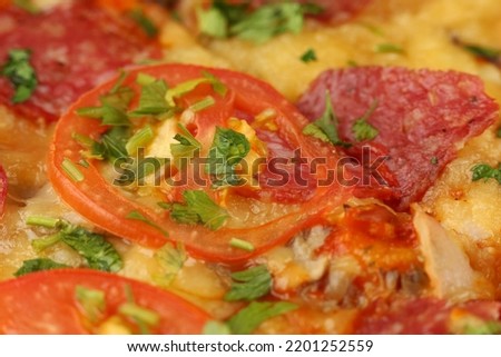 Pizza with sausage close-up. Pizza with Mozzarella cheese, salami, pepper.