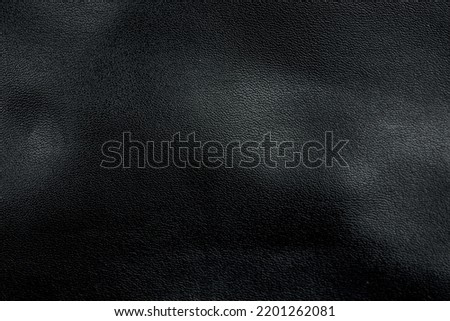 Abstract black leather texture background.  light and shadow.